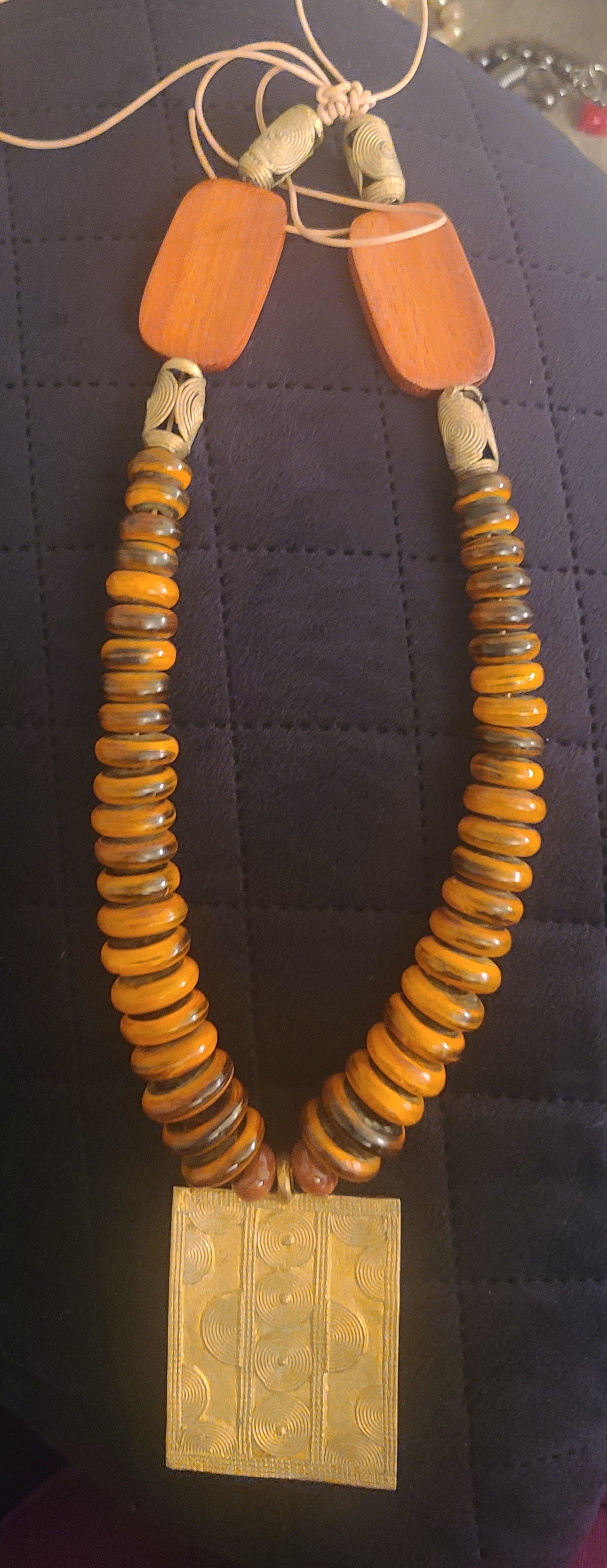 “Back to Her Roots” Tie-back Adjustable Necklace with Amber Colored Disk Beads and Brass Pendant